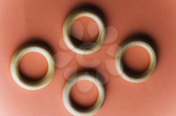 Close-up of four curtain rings