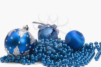 Three blue Christmas ornaments on string of blue beads