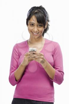 Portrait of a young woman text messaging