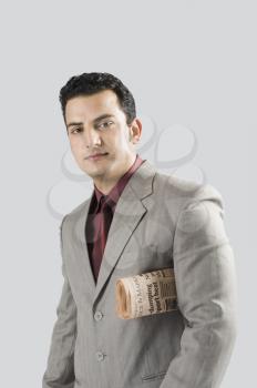 Businessman with a newspaper under his arm