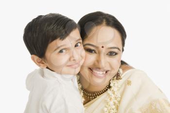 Portrait of a woman smiling with her son