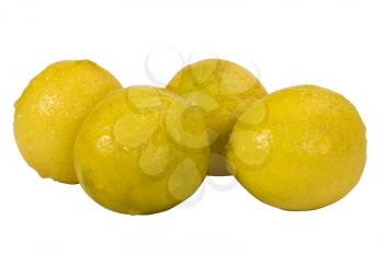 Close-up of four lemons
