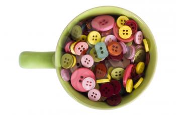Close-up of a cup full of buttons