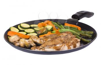 Chicken breasts with vegetable on a griddle