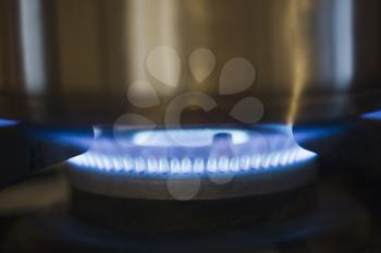 Close-up of a pan on a gas stove burner