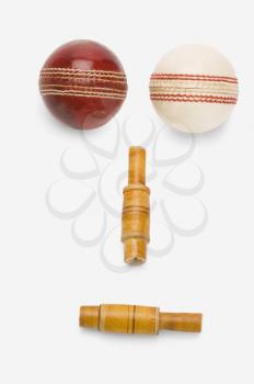 Cricket balls and bails forming an anthropomorphic face