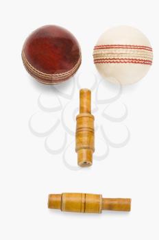 Cricket balls and bails forming a human face