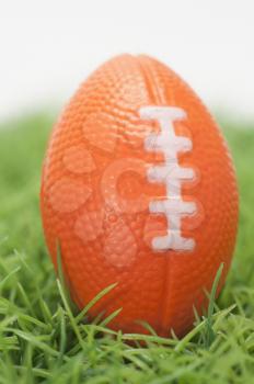 Close-up of an American football on grass
