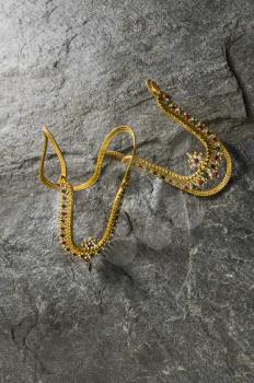 Close-up of a pair of gold armlets