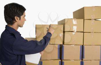 Store incharge counting cardboard boxes