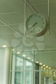 Low angle view of a clock at an airport lounge, Paris, France