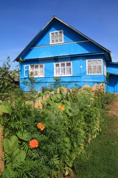 blue rural house on celestial background