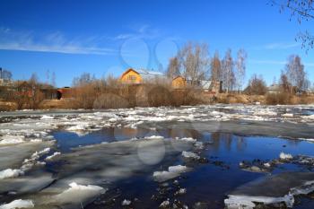 driving of ice on river near villages