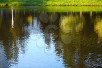 Landscape reflected in water. Nature background.