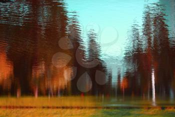 Landscape reflected in water. Abstract nature background.