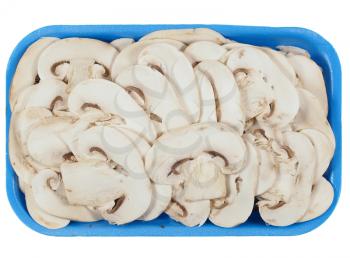 Sliced Agaricus bisporus aka champignons mushrooms isolated over white background in a tub