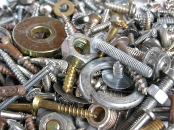 Industrial steel hardware bolts, nuts, screws useful as background
