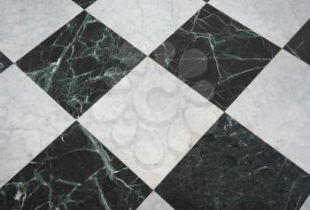 chequered white green and black stone floor useful as a background