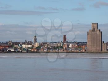 View of Birkenhead skyline across the Mersey river in Liverpool, UK