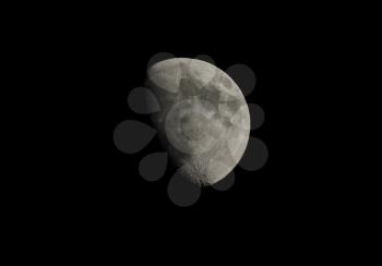 Gibbous moon over dark black sky seen with a telescope from northern emisphere at night