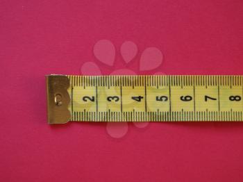 a ruler with metric units, over red background