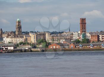 View of Birkenhead skyline across the Mersey river in Liverpool, UK