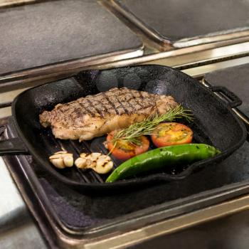 Tasty steak with vegetable cooking in the pan at kitchen