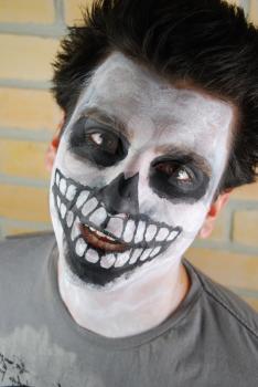 Royalty Free Photo of a Man With His Face Painted 

