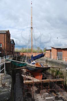 Royalty Free Photo of an Antique Boat Reparation at Dry Docks