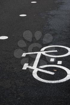 Royalty Free Photo of a Bicycle Road Sign on Pavement