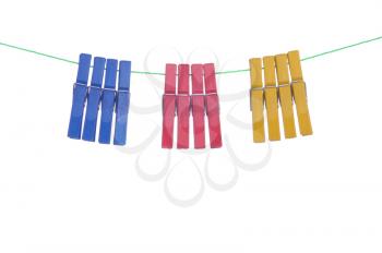 Royalty Free Photo of Clothespins Hanging on a Washing Line