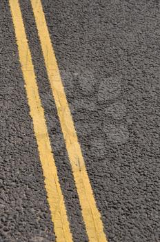 Royalty Free Photo of Double Yellow Lines on the Asphalt Road