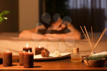 Spa treatments with blurred man on background indoors�