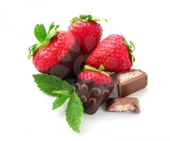 Delicious strawberries covered with chocolate on white background�