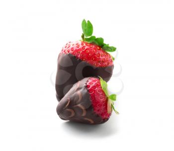 Delicious strawberries covered with chocolate on white background�