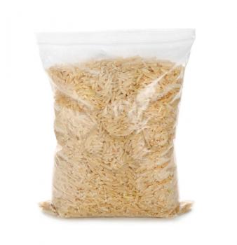 Zipper bag with raw brown rice on white background�