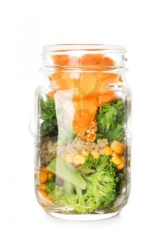 Delicious vegetable salad in mason jar on white background�