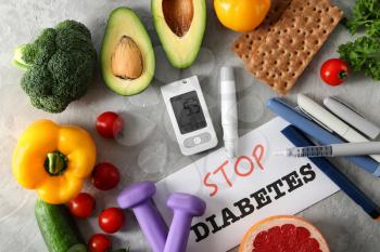 Composition with glucometer and healthy food on grey background. Diabetes diet�
