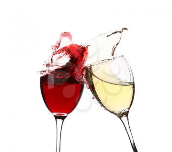 Glasses with splashing wine on white background�