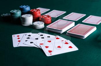 Chips and cards on table in casino�