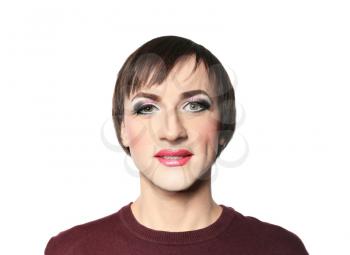 Portrait of transgender man with bright makeup on white background�