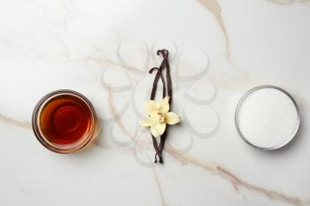 Composition with vanilla extract and sugar on table�