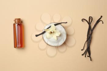Composition with vanilla extract and sugar on color background�