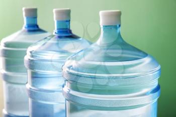 Bottles of fresh water on color background�