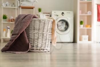 Basket with laundry in room�
