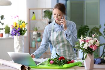 Florist taking order by phone in shop�