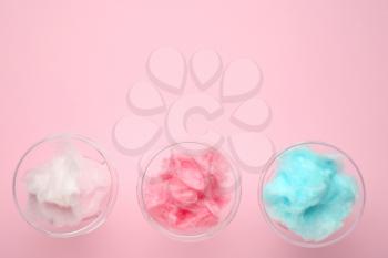 Glasses with tasty cotton candy on color background�