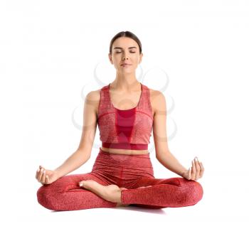 Sporty woman practicing yoga on white background�