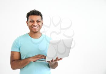 Happy man with laptop on white background�