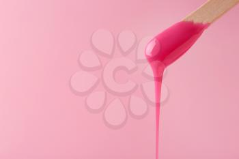 Stick with sugaring paste on color background�